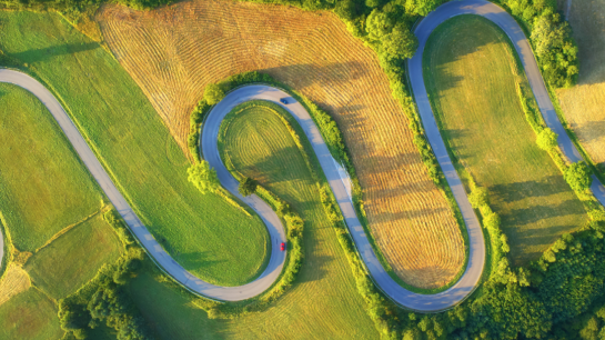 An aerial shot of a curvy road 